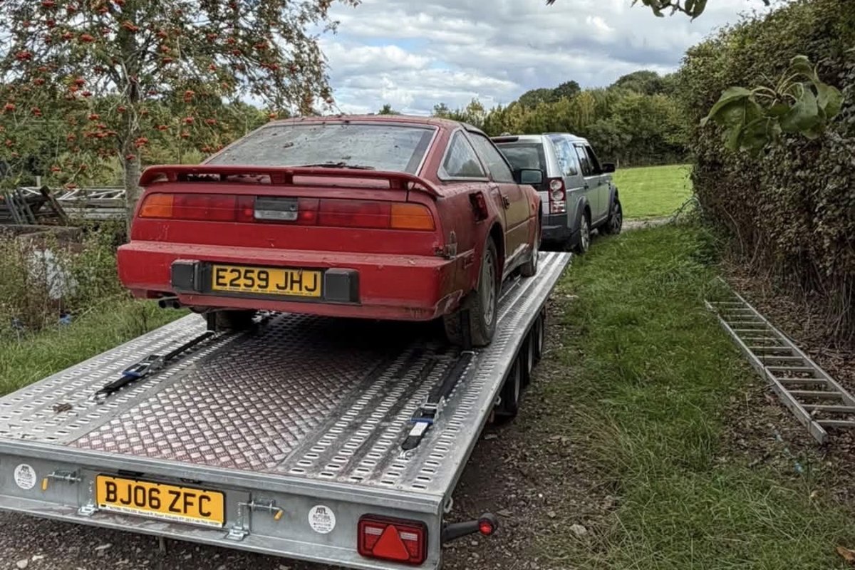 Classic red Nissan 300ZX collected and transported on the trailer
