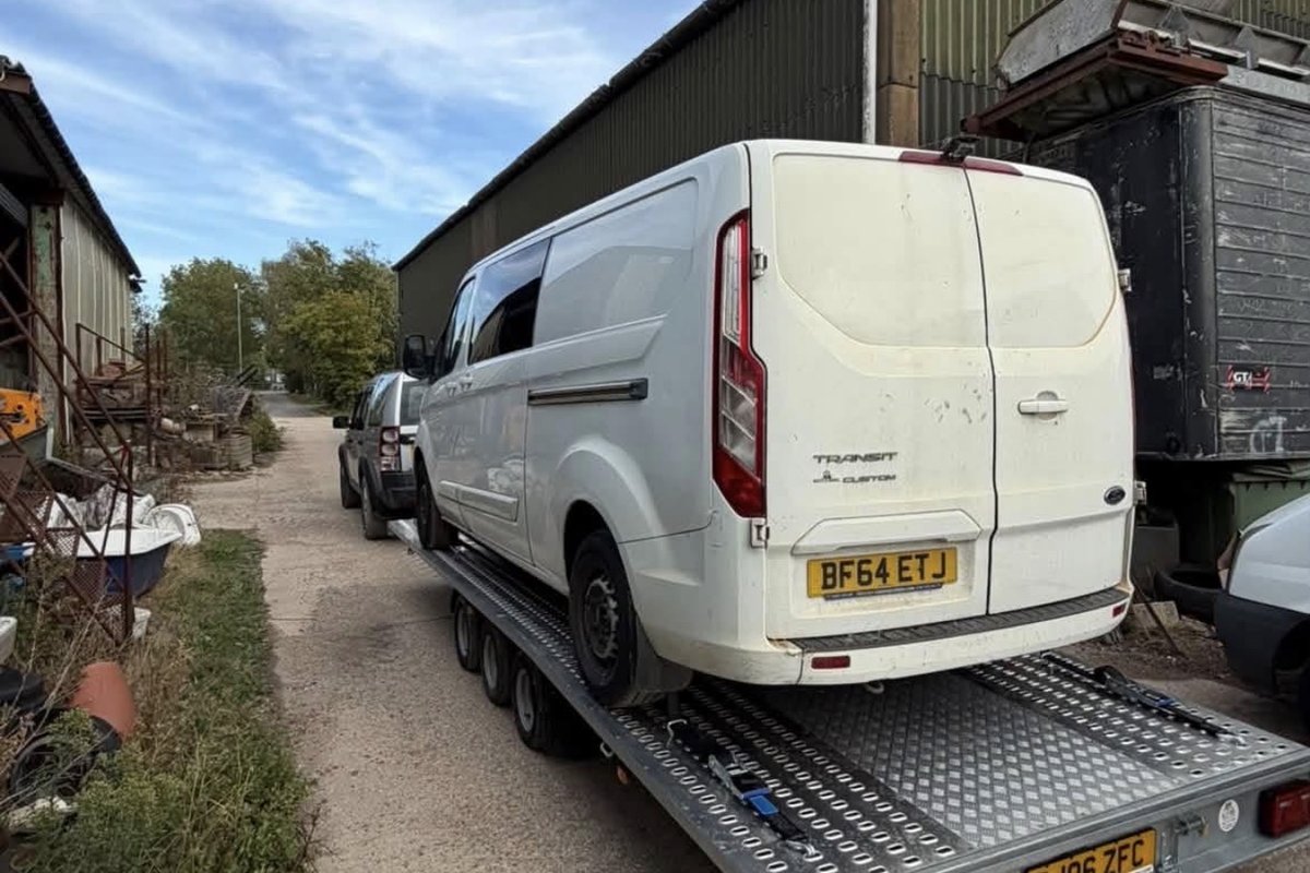 White Ford Transit Custom van recovered onto the transporter trailer